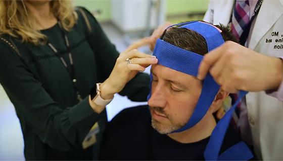 Michael being prepped for noninvasive brain stimulation